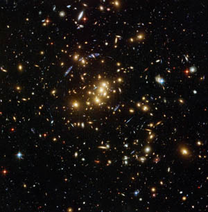 Image of the rich galaxy cluster catalogued as Cl 0024+17, allowing astronomers to probe the distribution of dark matter in space.