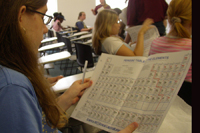 Girl examines her periodic table