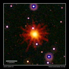 Images from Swift's Ultraviolet/Optical (white, purple) and X-Ray telescopes (yellow and red) were combined to make this view of Swift J1644+57.