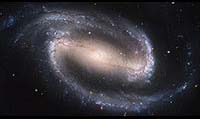 NGC 1300 is a classic example of a spiral galaxy with a bar in the central bulge.