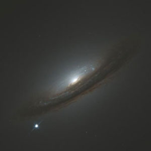 A type Ia supernova (lower left) occurred in NGC 4526.
