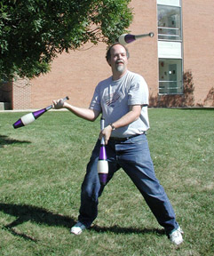 Mike juggling clubs