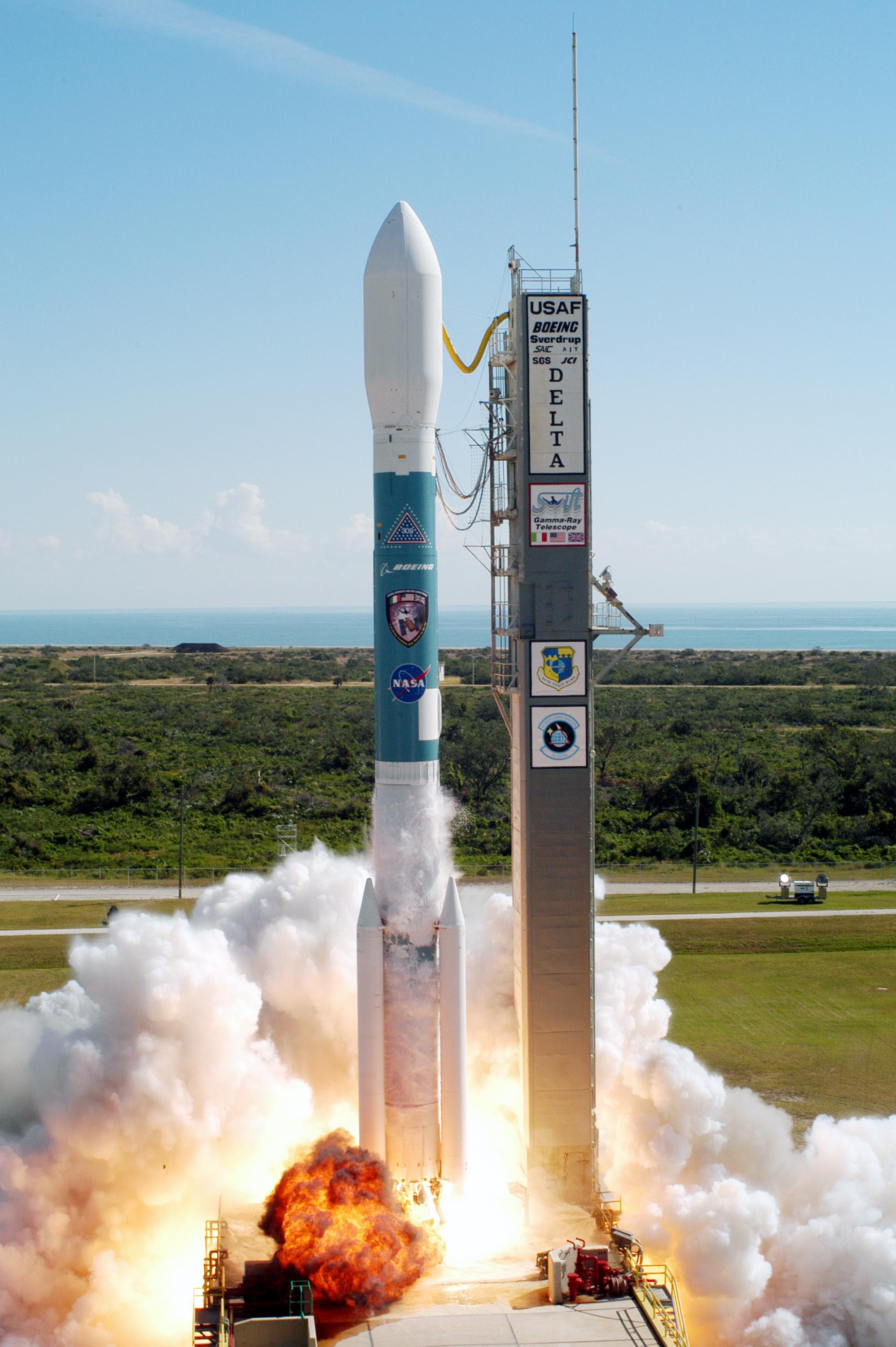 The engines of a Boeing Delta II expendable launch vehicle ignite to blast NASA's Swift spacecraft on its way at Complex 17A